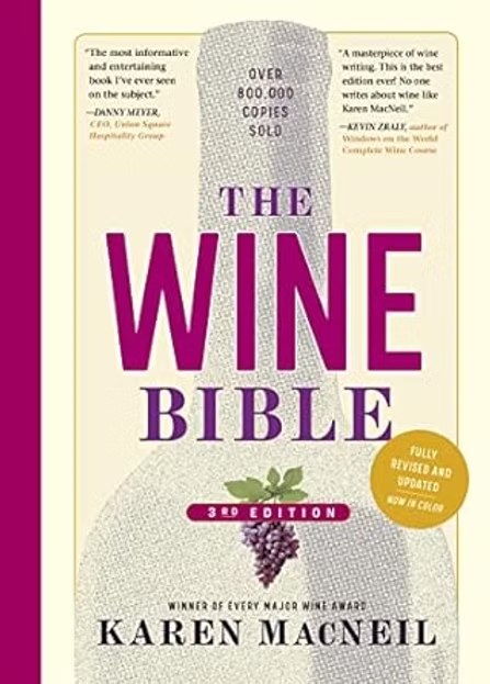 Book cover of The Wine Bible by Karen MacNeil, with cream background, magenta title, grape icon, and text over 800,000 copies sold.