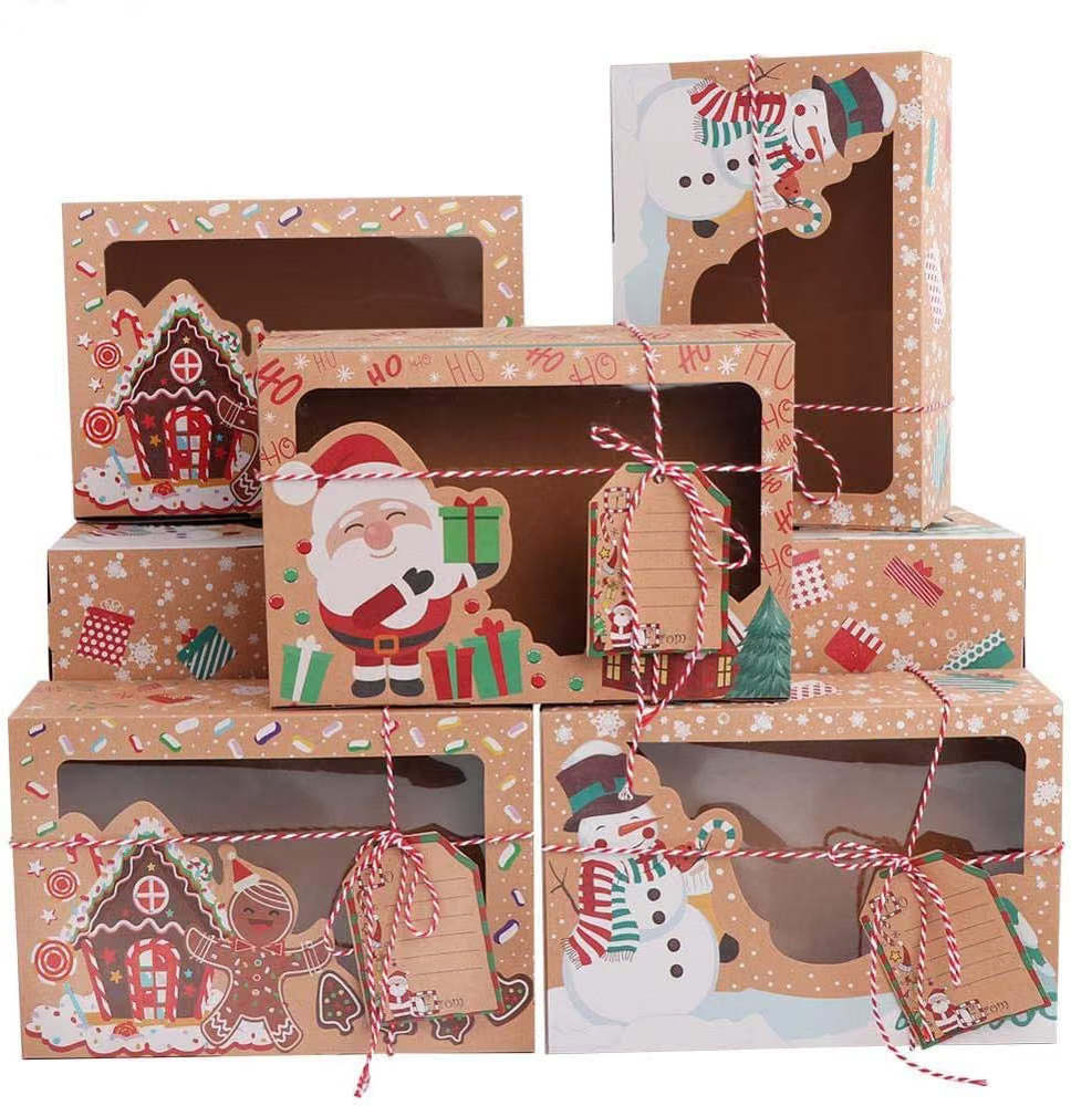 Five Christmas gift boxes with window cutouts, decorated with Santa, snowman and gingerbread house, tied with red-and-white twine.