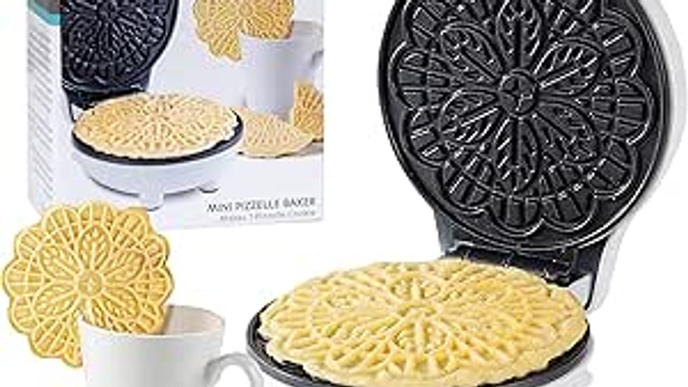 Pizzelle maker open with golden pizzelle inside, surrounded by other pizzelles and a white mug. Box labeled "CucinaPro."