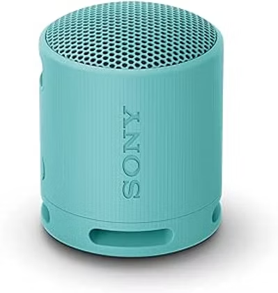 Turquoise Sony portable speaker with perforated top grille, shown on a white background.