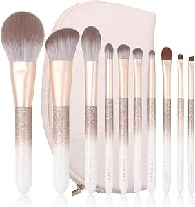 Makeup brush set with a white and gold gradient design, arranged in a neat line. Includes a white carrying pouch in the background.