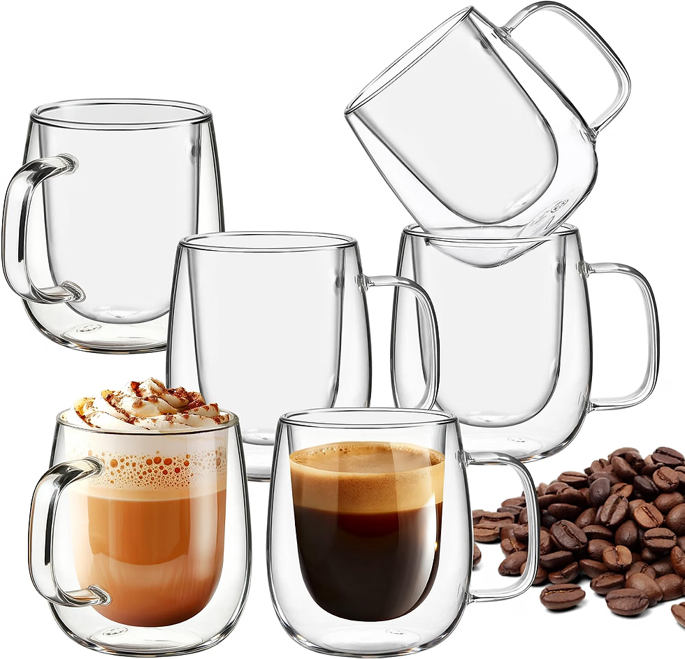 Five clear double-walled glass coffee mugs on white, two filled with latte and espresso, coffee beans scattered nearby.