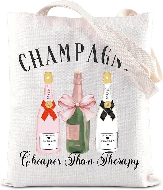 Tote bag with illustrations of three champagne bottles, text "Champagne Cheaper Than Therapy." Features pink, red, and black colors.