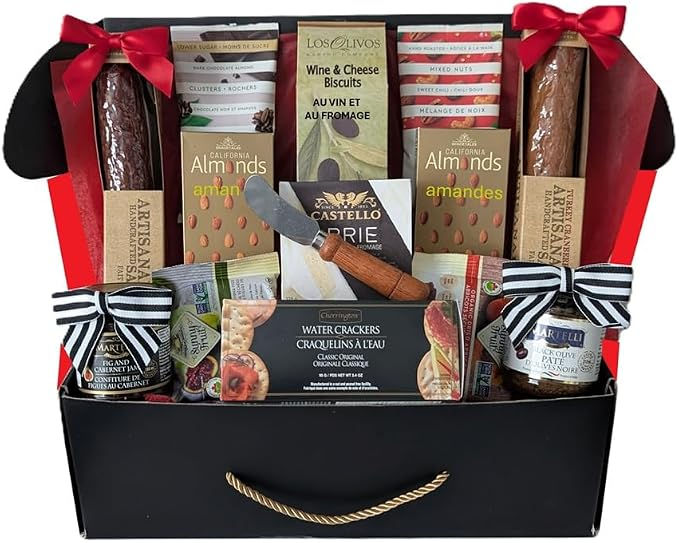 Gourmet gift basket with wine-and-cheese biscuits, almonds, crackers, jars, and salami, decorated with red and striped bows.