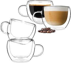 Four clear double-walled glass coffee cups, two filled with coffee, surrounded by coffee beans. Simple and elegant design.