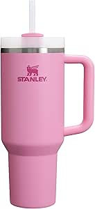 Pink Stanley mug with handle and lid featuring a white straw. The brand logo is visible. Simple, clean design on a white background.