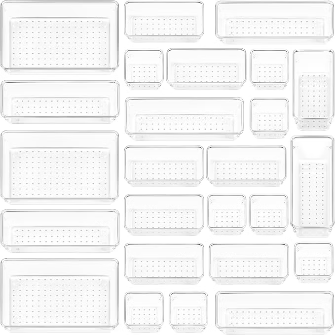 Assorted clear plastic food storage containers in various sizes arranged on a white background, with perforated bases and lids.