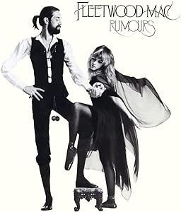 Man and woman posed in black-and-white outfits; she stands on a stool. Text: "Fleetwood Mac Rumours." White background.