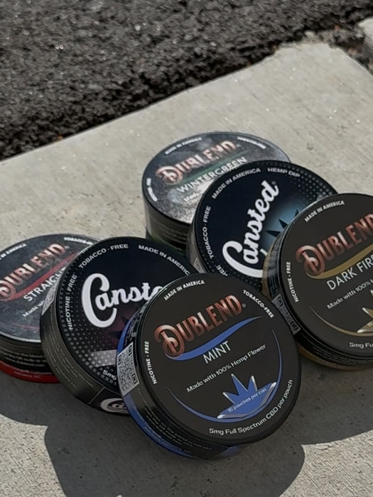 Cans of Dublend and Cansted on pavement