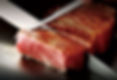 The Samurai Teppanyaki House's chef skilfully grilling beef slices on a Teppan.
