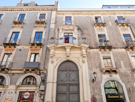 a building with a sign that says nuts on it