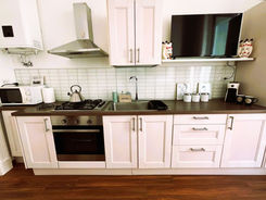 a kitchen with white cabinets and a sink that says kitchen