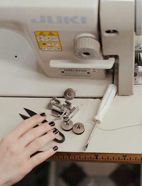 person-using-white-sewing-machine-462220