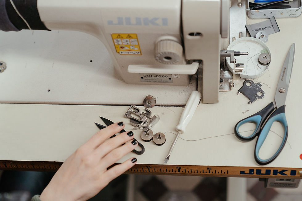 person-using-white-sewing-machine-462220