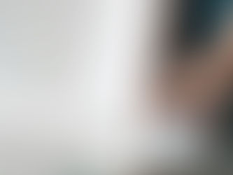 Amazon Echo smart speaker with blue glow on a reflective surface, a beginner-friendly smart home device for independent living