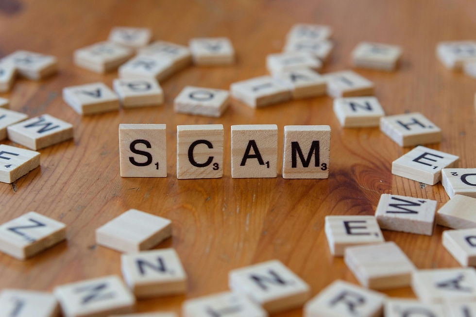 scrabble tiles spelling the word scam representing online fraud and scam reporting in Canada