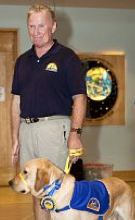 Bubba and his puppy raiser. Photos by Ken Sergi Photography