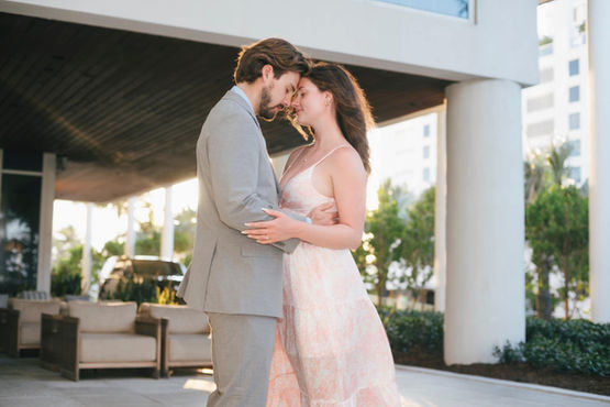 hugging couple with their eyes closed loving one another.