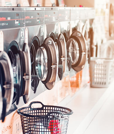 row-of-industrial-laundry-machines-in-laundromat-i-2021-08-31-06-47-21-utc.jpg