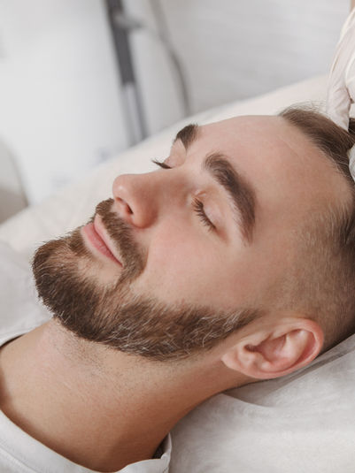 Man receiving PRP therapy for hair loss/balding