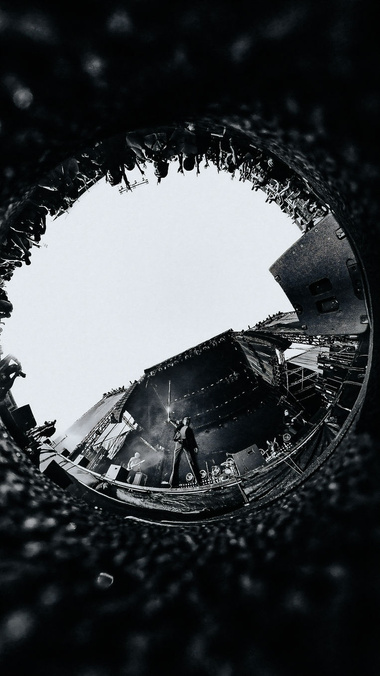 Cage the Elephant lead singer performing live on stage, concert photography by Maxwell Thomason