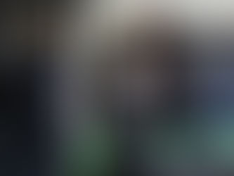 A man with quadriplegia is walking on the treadmill while his therapist watches.