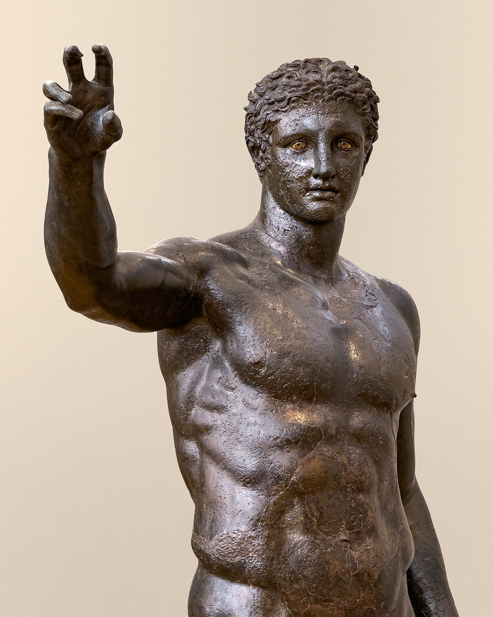 Upper body shot of the Antikythera Ephebe or Antikythera Youth, a statue found in the Antikythera shipwreck. Image via Wikimedia Commons.