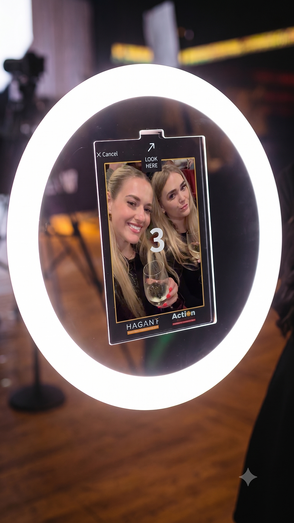 Two women using a roamer booth hire at an event.