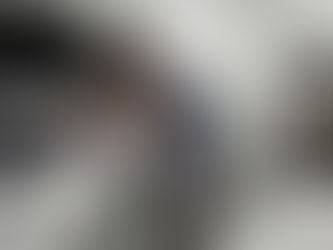 Mechanic inspecting a dead car battery to diagnose why the car battery dies.