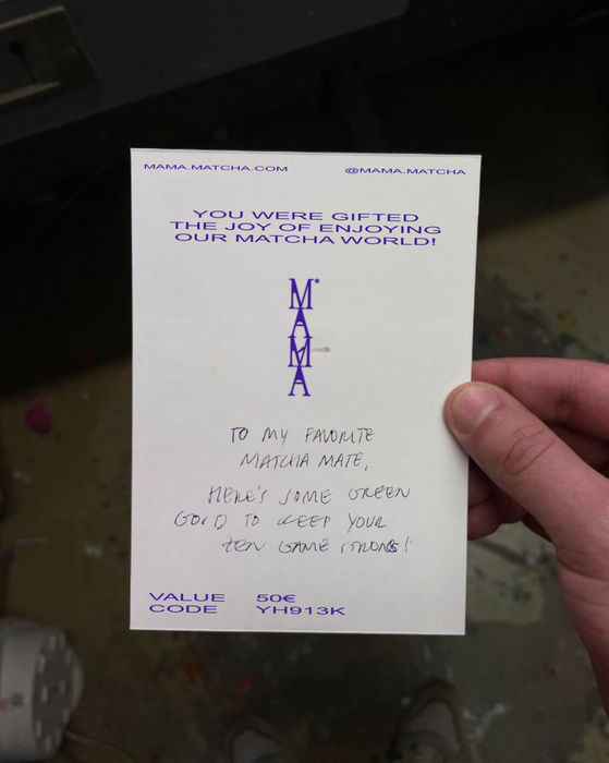 An image showcasing MAMÁ, the rebranding of a family-owned matcha business. The design merges elements of Japanese culture with bold, modern aesthetics. Vibrant green tones echo the energy of matcha, while clean lines and thoughtful typography reflect a balance of tradition and contemporary style. The packaging and branding materials convey a fresh, dynamic identity that honors the heritage of the brand.