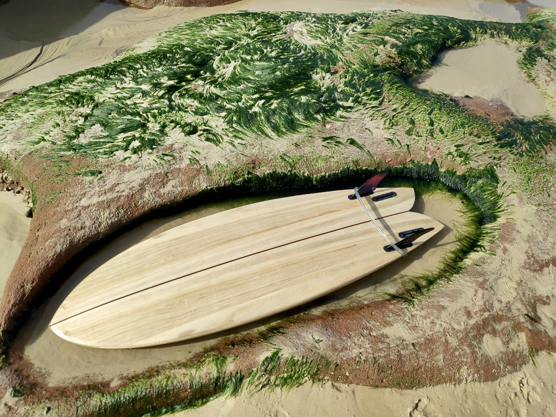 Surf brand with retro-inspired, eco-friendly designs, handmade wooden boards, and workshops.