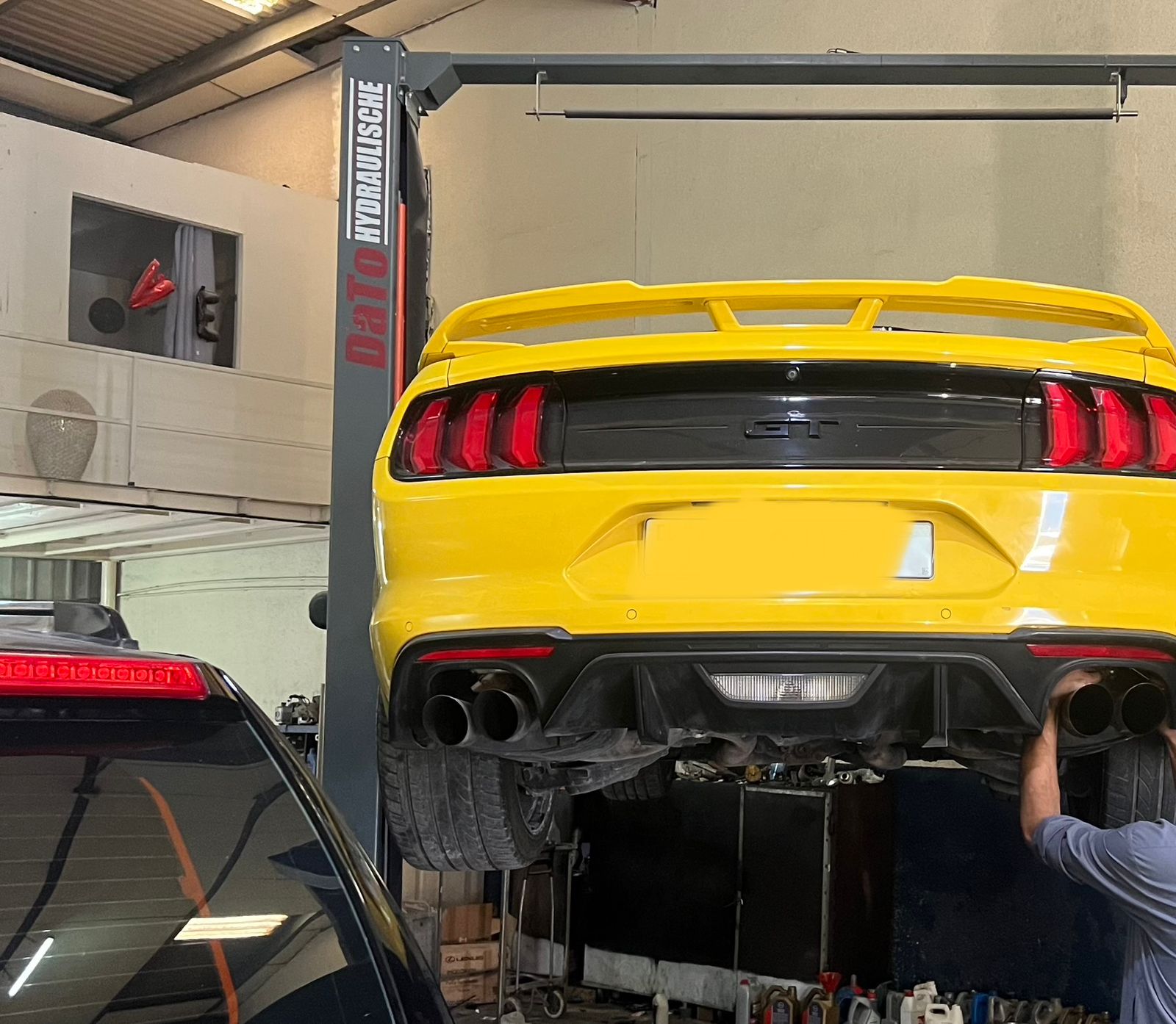 Ford Mustang GT on the lift at Mr Fix It All Garage, Al Quoz, Dubai