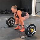 client deadlifting in the gym