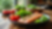 Eye-level view of a balanced meal with fresh vegetables and lean protein on a wooden table