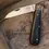 Miniaturbild: Fox Knives Core Micarta Brown: Schwarzes Taschenmesser mit brauner Micarta-Griffschale