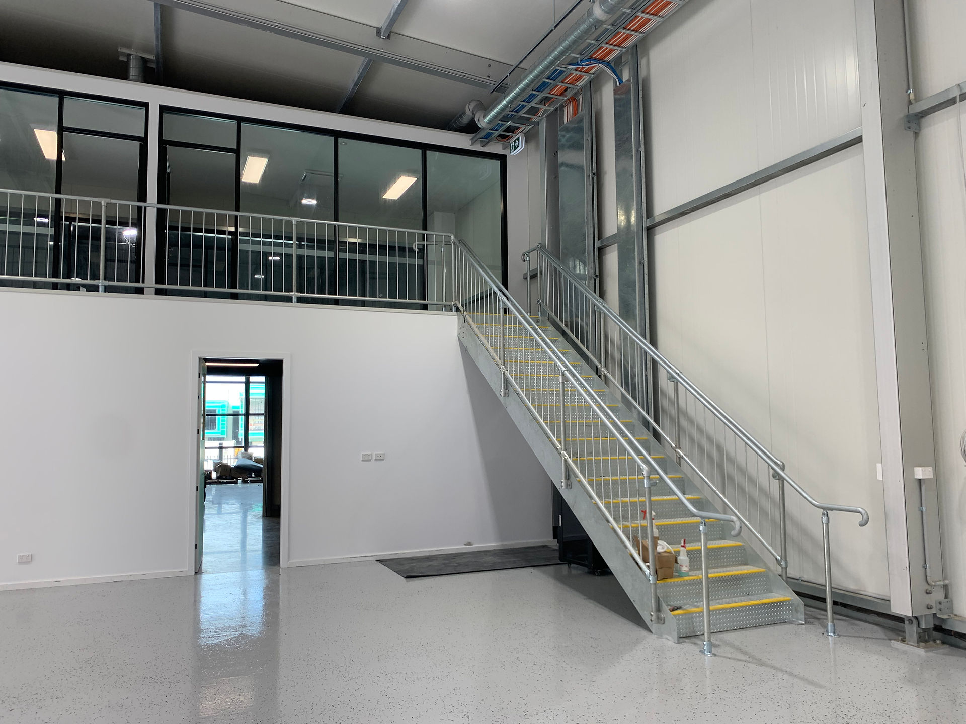 Retail building double level staircase