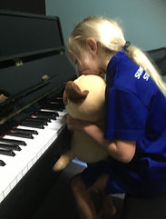 Learning to play piano with a friend