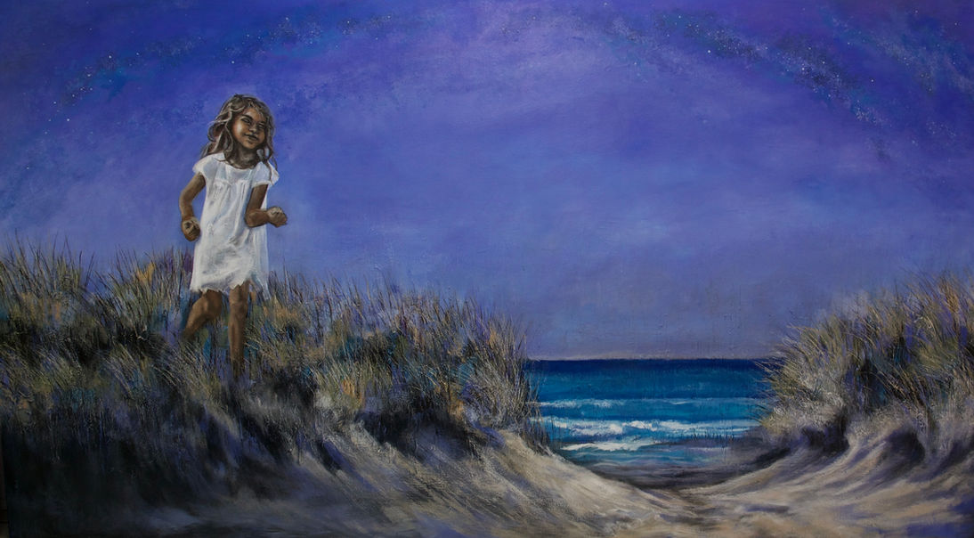 Beachscape at Last Light. A young indigenous girl plays in the dunes. 