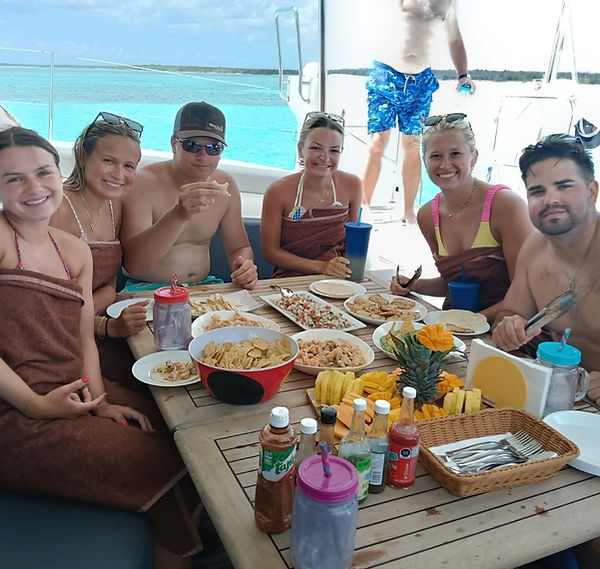 Guests enjoying a freshly prepared lunch aboard Catamaran Nemo in Cozumel