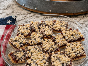 These Jam Crumb Bars have a buttery shortbread base, a layer of sweet fruit preserves, and a crumbly topping that will become a friends and family favorite.