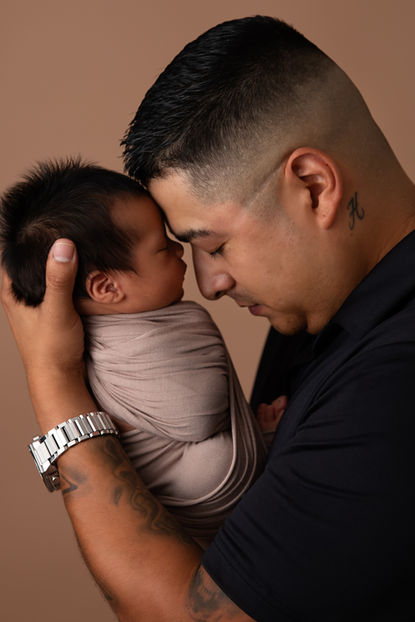 Newborn Baby Boy with dad photographed by Jennifer Rodriguez Photography located in Overland Park, KS.
