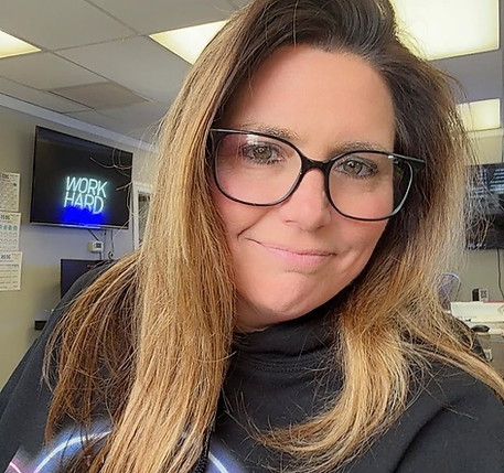 Colleen Basinski wearing Do Epic Shit hoodie in podcast studio