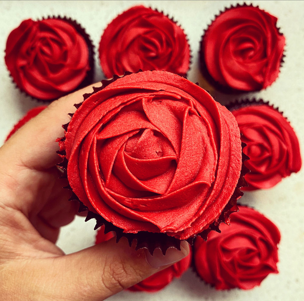 Chocolate cupcakes with buttercream rose icing