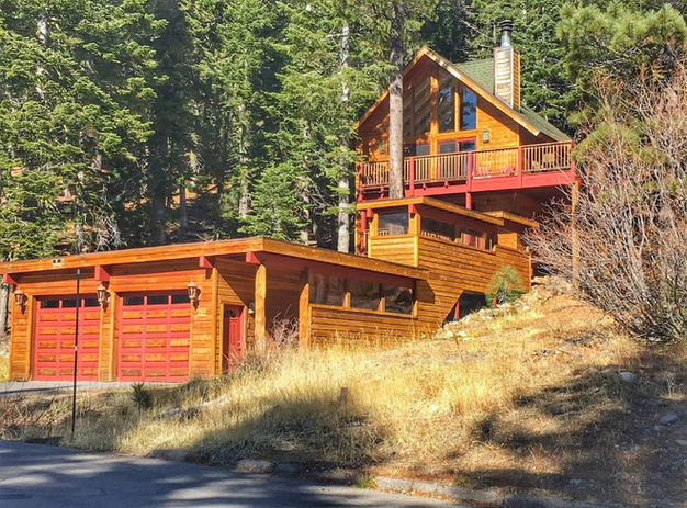 Chalet style home with enclosed walkway