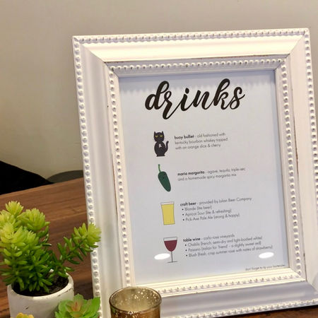 Custom Drink Menu displayed in a picture frame on a table