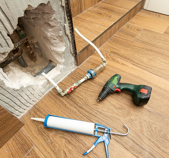 damage water piping system in restroom water leak on wall