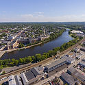 Aerial View Of Waltham, Massachusetts With Charles River, Downtown Buildings, And Railroad Tracks