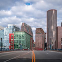 Downtown Boston Skyline With Modern Glass Towers And Historic Brick Buildings Viewed From Bridge