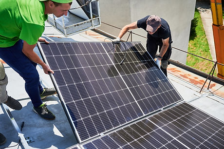 technicians installing a solar panel