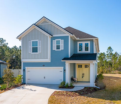 modern two-story house with a front porch and garage